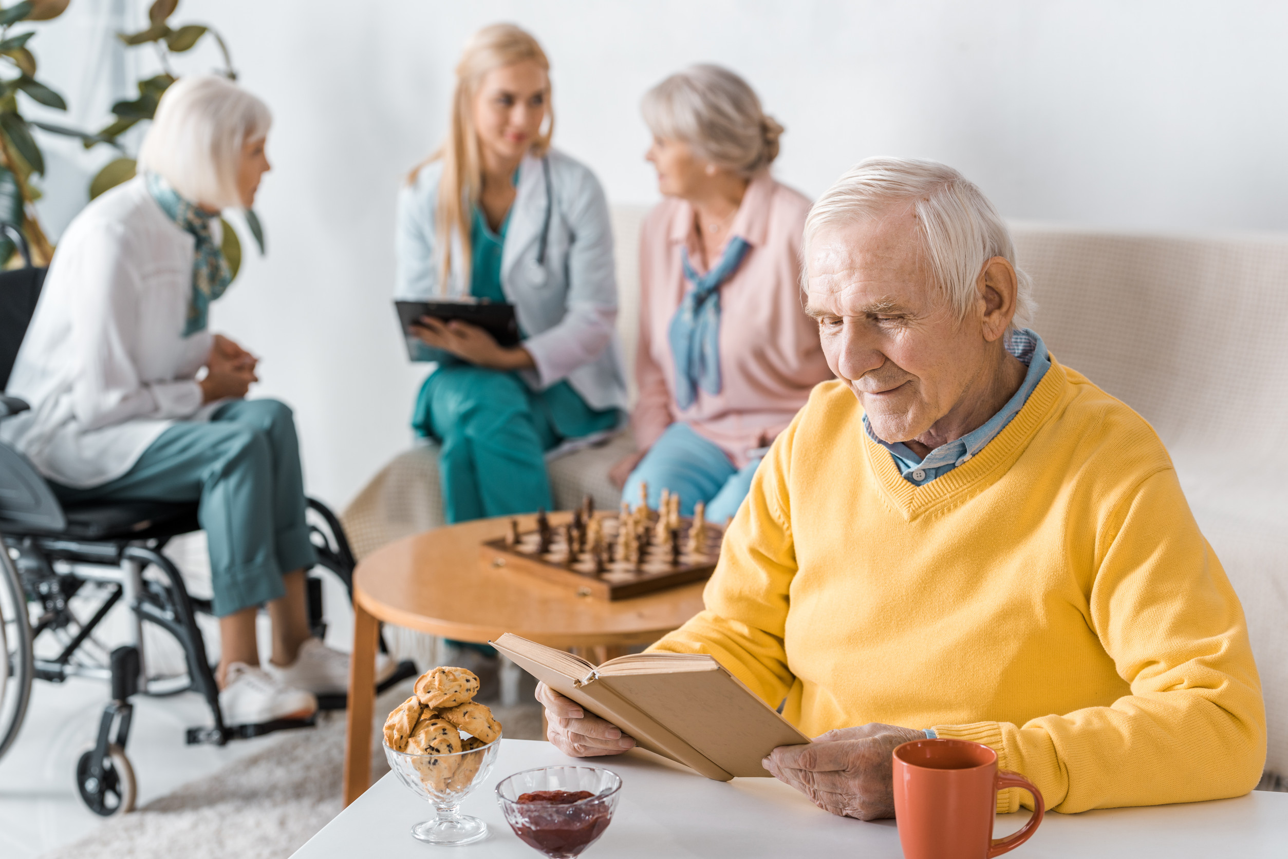 Old couple, portrait and helping man in wheelchair, home and support husband with injury